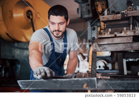 Experienced operator in a hard hat. Metalworking industry concept professional engineer metalworker Experienced operator in a hard hat. Metalworking industry concept professional engineer metalworker 59853813