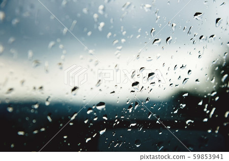 Natural background Drops on both sides of the glass from the rain and from the fogging abstract view Natural background Drops on both sides of the glass from the rain and from the fogging abstract view 59853941