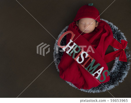 Shoot Newborn Photo with Christmas specifications! Background green red costume copy space left 59853965