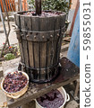 Making wine at home. Old wooden wine press 59855031
