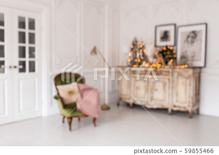 Blurred photo of dresser with Christmas decorations standing on it stands next to chair Blurred photo of dresser with Christmas decorations standing on it stands next to chair 59855466