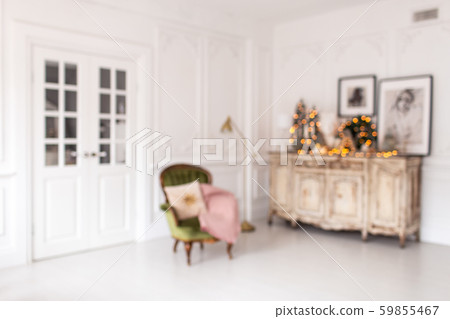 Blurred photo of dresser with Christmas decorations standing on it stands next to chair Blurred photo of dresser with Christmas decorations standing on it stands next to chair 59855467