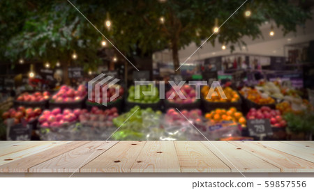 Empty wood table top with fruit market blurred 59857556