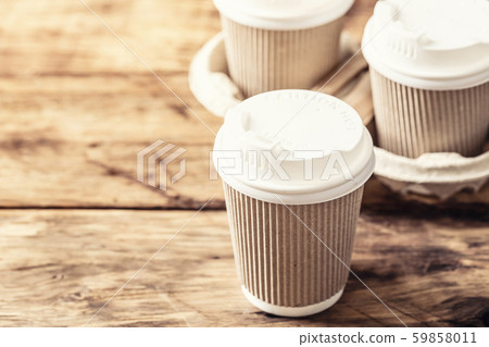 Coffee or tea in a paper cup with a lid Coffee or tea in a paper cup with a lid 59858011