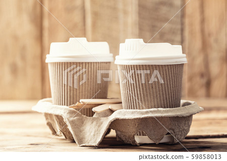Coffee or tea in a paper cup with a lid Coffee or tea in a paper cup with a lid 59858013