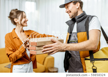 Courier delivering pizza home Courier delivering pizza home 59858324