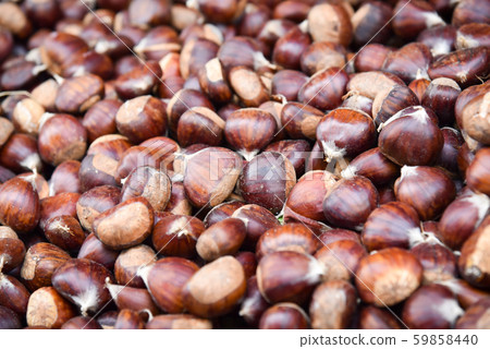 Closeup of a group of chestnuts . 59858440