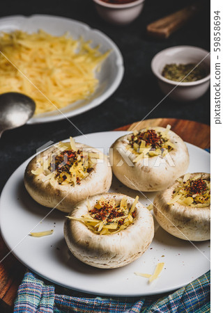 Button mushrooms stuffed with cheese and spices Button mushrooms stuffed with cheese and spices 59858694