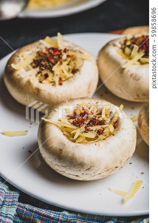 Button mushrooms stuffed with cheese and spices Button mushrooms stuffed with cheese and spices 59858696