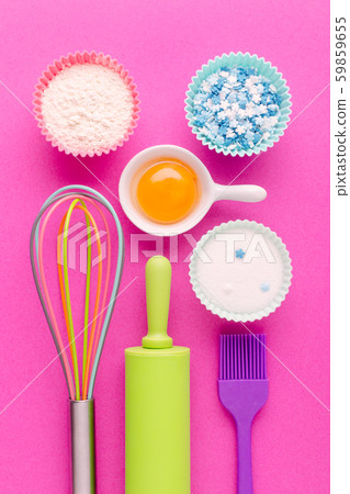 ingredients for baking and kitchen tools on pink background ingredients for baking and kitchen tools on pink background 59859655