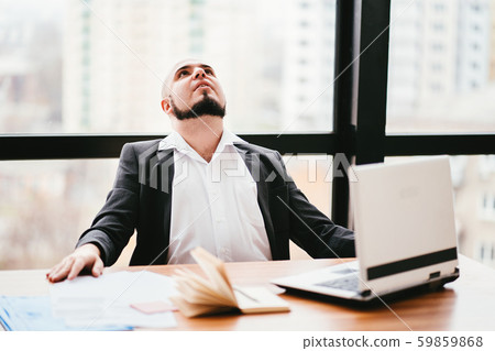 Successful businessman satisfied and relaxed Successful businessman satisfied and relaxed 59859868