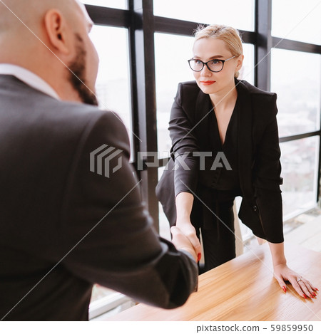 Business partners shaking hands, sealing a deal 59859950