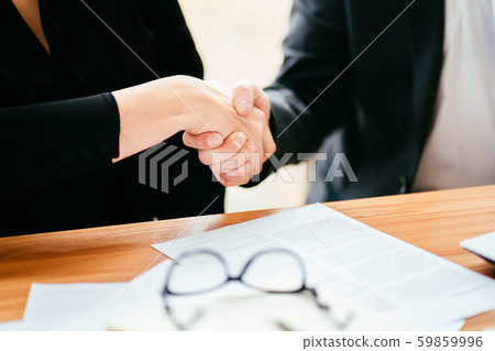 Business partners shaking hands, close up Business partners shaking hands, close up 59859996