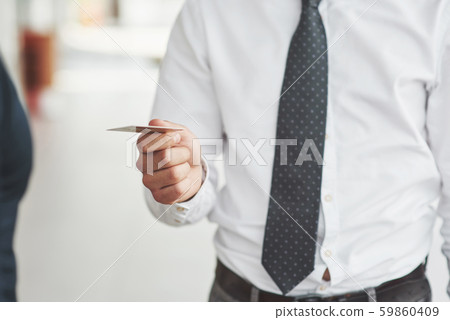plastic card in the hands of a man plastic card in the hands of a man 59860409