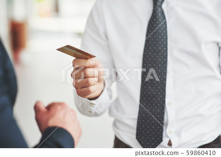 plastic card in the hands of a man plastic card in the hands of a man 59860410