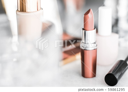 Cosmetics, makeup products on dressing vanity 59861295