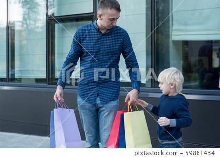 Father and little son with colorful shopping bags 59861434