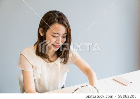 Woman doing make-up Woman doing make-up 59862203