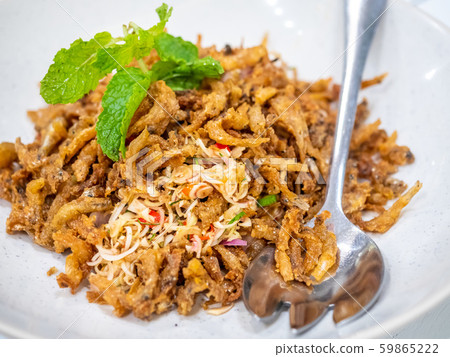 Crunchy small fish fried with pepperment in spicy Thai style cooking 59865222