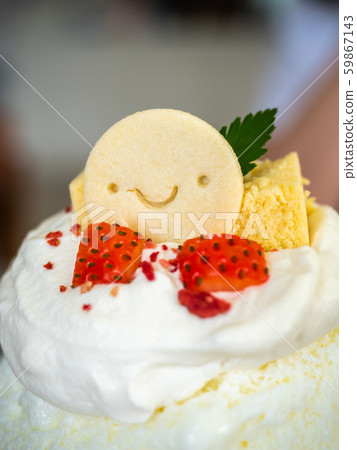 Kakigori, Japanese shaved ice dessert flavored with condensed milk, topping with smiled cookey 59867143