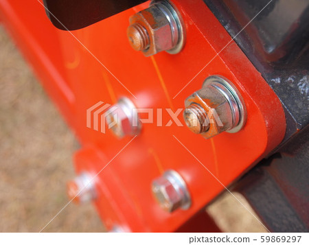 Tractor Knot - Closeup On the background of the metal painted orange red. Selective focus 59869297