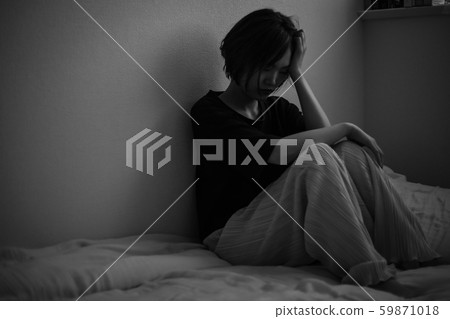 A woman in sadness 59871018