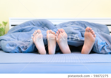 Two pairs of feet of kids. Brother and sister Two pairs of feet of kids. Brother and sister 59872275