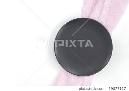 Empty black plate on dark stone background. Empty black plate on dark stone background. 59877117