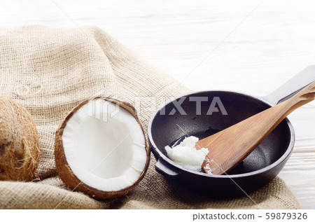 Coconut, shell with meat, cast iron skillet and Coconut, shell with meat, cast iron skillet and 59879326