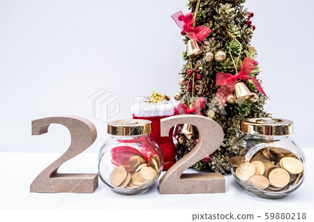 Beautifully decorated Christmas tree with a holiday party beginning in the new year and crossing to year 2020 Beautifully decorated Christmas tree with a holiday party beginning in the new year and crossing to year 2020 59880218