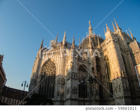 Milan Cathedral Duomo bathing in the morning sun under the clear blue sky Milan Cathedral Duomo bathing in the morning sun under the clear blue sky 59881811