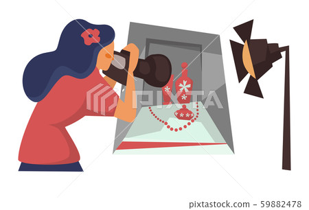 Photographer with camera taking photo of still life composition 59882478
