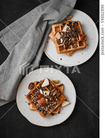 Homemade waffles with fruit and granola. Homemade waffles with fruit and granola. 59882890