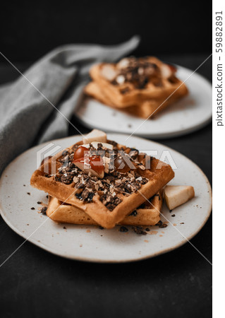 Homemade waffles with fruit and granola. Homemade waffles with fruit and granola. 59882891