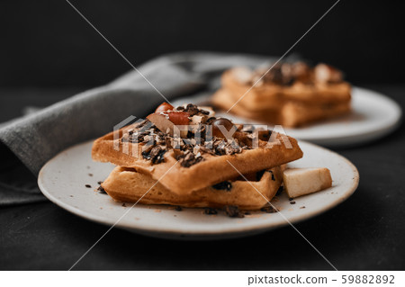 Homemade waffles with fruit and granola. Homemade waffles with fruit and granola. 59882892