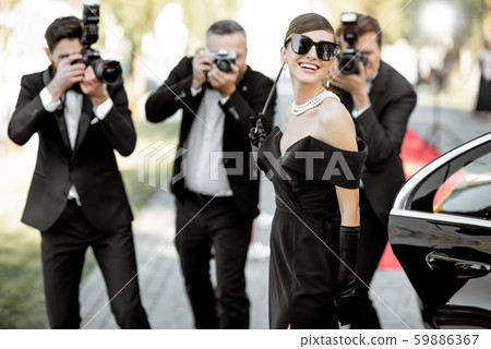 Photo reporters photographing actress ariving on the awards ceremony Photo reporters photographing actress ariving on the awards ceremony 59886367