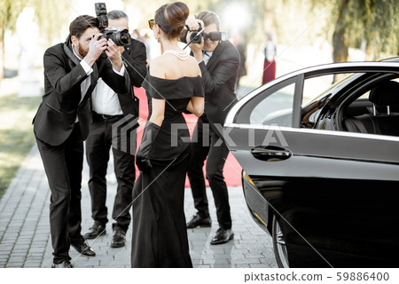 Photo reporters photographing actress ariving on the awards ceremony Photo reporters photographing actress ariving on the awards ceremony 59886400