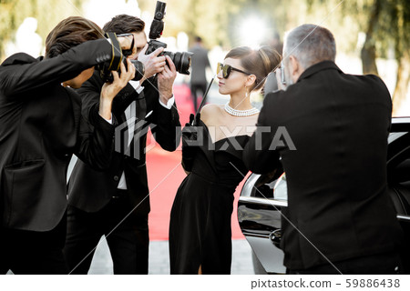 Photo reporters photographing actress ariving on the awards ceremony 59886438