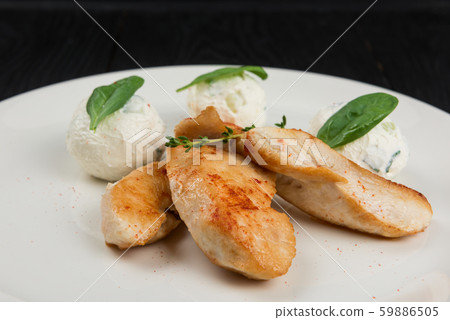 Grilled chicken breast with mozzarella cheese. 59886505