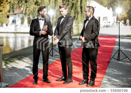 Film actors on the red carpet outdoors 59886596