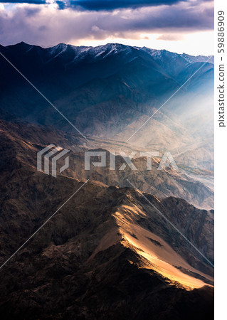 Aerial view of Snow Mountain and light of sunrise on the top himalaya mountains from the plane Aerial view of Snow Mountain and light of sunrise on the top himalaya mountains from the plane 59886909