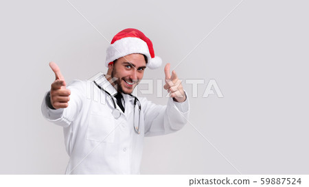 Young handsome doctor in white uniforme and Santa 59887524