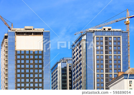 The glass facade, a reflection of the blue sky 59889054