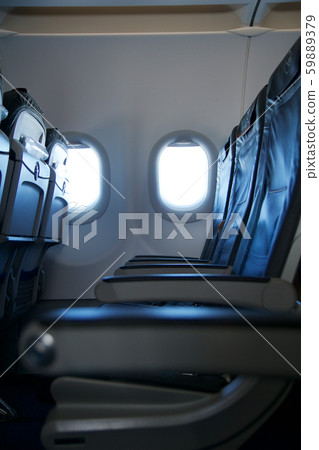 FRANKFURT, GERMANY - JAN 20th, 2017: Airplane business class seat and window inside an Lufthansa FRANKFURT, GERMANY - JAN 20th, 2017: Airplane business class seat and window inside an Lufthansa 59889379