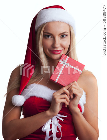 Woman in santa dress with gift Woman in santa dress with gift 59889477