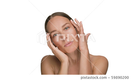 Close-up beauty portrait of young woman with smooth healthy skin, she gently touches her face with Close-up beauty portrait of young woman with smooth healthy skin, she gently touches her face with 59890200