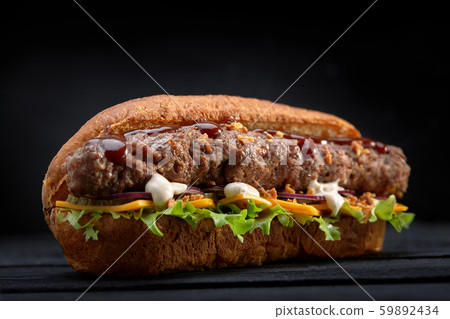 close up of kebab sandwich on black wooden background 59892434