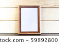 Vertical Dark Brown Picture Frame on Wooden Planks 59892800