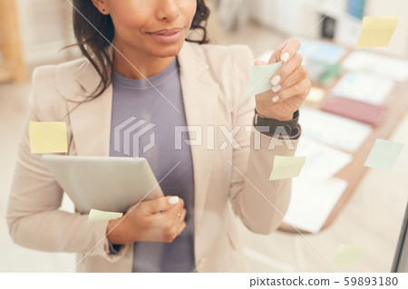 Businesswoman Planning Project by Glass Wall Background Businesswoman Planning Project by Glass Wall Background 59893180
