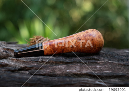 This Tobacco pipe is made from burl wood at white background This Tobacco pipe is made from burl wood at white background 59893901